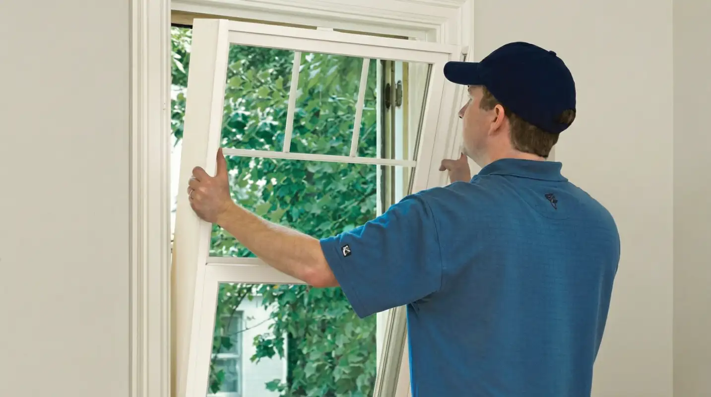 Professional contractors performing a residential window insulation and replacement service in Fort Lauderdale, FL